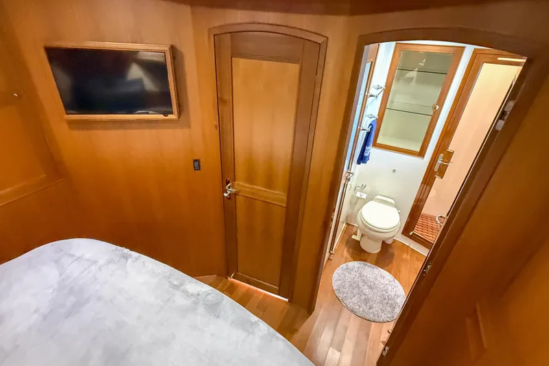 Slide: The Image of Luxurious Marlow 53E 2018 yacht interior with ensuite bathroom and mounted TV. - 78