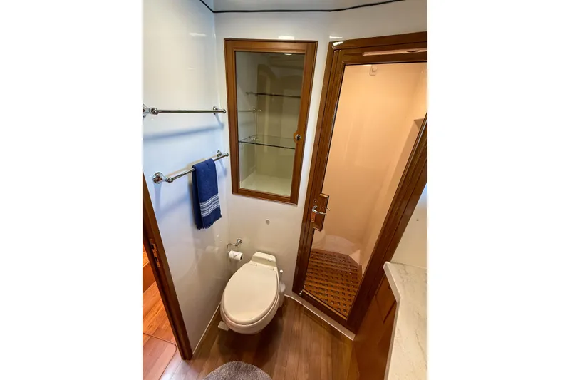 Slide: The Image of Luxurious bathroom in 2018 Marlow 53E yacht with wooden accents and modern fixtures. - 80