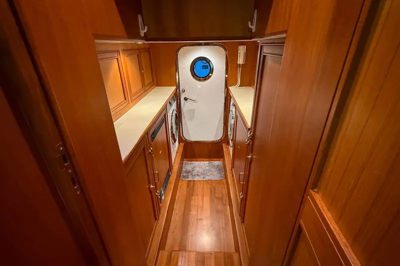 Slide: The Image of Luxurious wooden interior of 2018 Marlow 53E yacht with modern amenities and porthole door. - 82