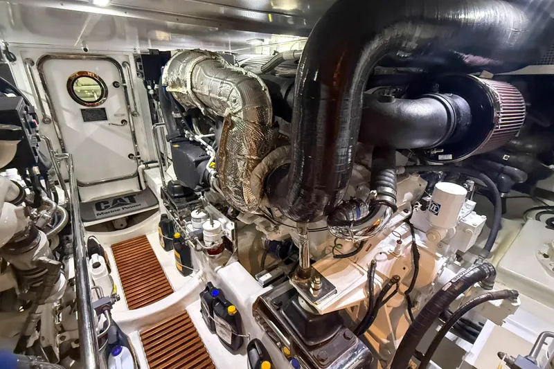 Slide: The Image of Engine room of a 2018 Marlow 53E yacht, featuring CAT Marine Power components. - 88