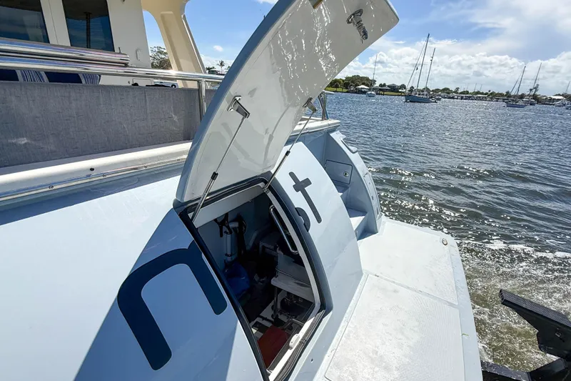 Slide: The Image of 2018 Marlow 53E yacht with open hatch, docked by the water. - 91