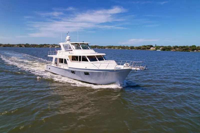 Slide: The Image of 2018 Marlow 53E yacht cruising on a sunny day in open waters. - 95