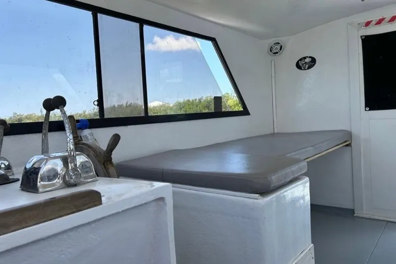 Slide: The Image of Interior of 2005 Crusader 34 SF boat with seating and controls. - 4