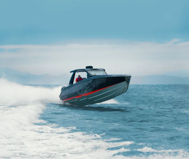 Slide: The Image of Cigarette 41' Nighthawk 2025 speeding on open water, showcasing sleek design. - 2