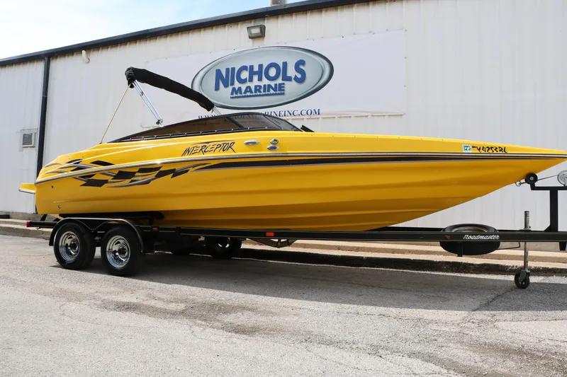 The Image of Yellow 2012 Caravelle Interceptor 232 Bow Rider boat on trailer at Nichols Marine. - 1