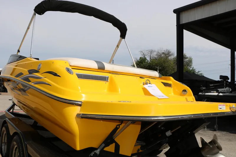 Slide: The Image of Yellow 2012 Caravelle Interceptor 232 Bow Rider boat on trailer, rear view. - 10