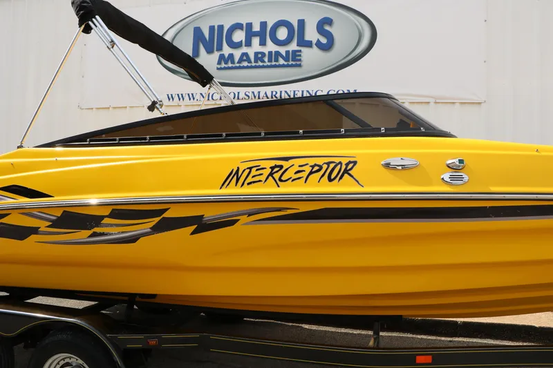 Slide: The Image of Yellow 2012 Caravelle Interceptor 232 Bow Rider boat at Nichols Marine dealership. - 11