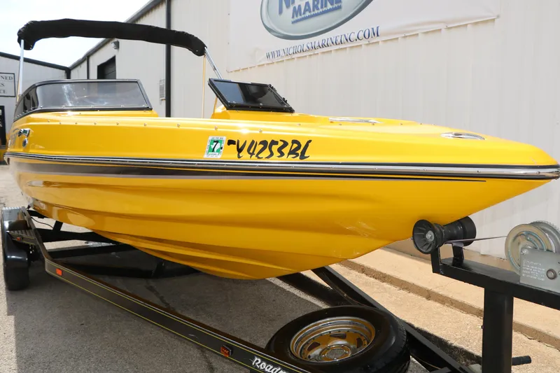 Slide: The Image of 2012 Caravelle Interceptor 232 Bow Rider in vibrant yellow on a trailer. - 13