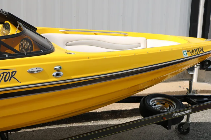 Slide: The Image of Yellow 2012 Caravelle Interceptor 232 Bow Rider boat on trailer. - 16