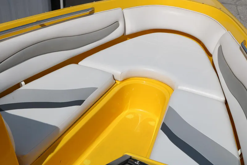 Slide: The Image of 2012 Caravelle Interceptor 232 Bow Rider with yellow and white seating area. - 21