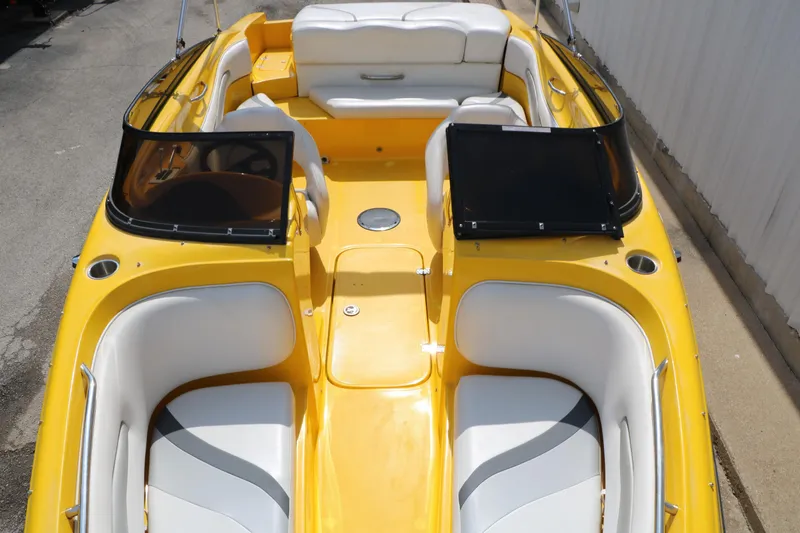 Slide: The Image of 2012 Caravelle Interceptor 232 Bow Rider with yellow exterior and white seating. - 22