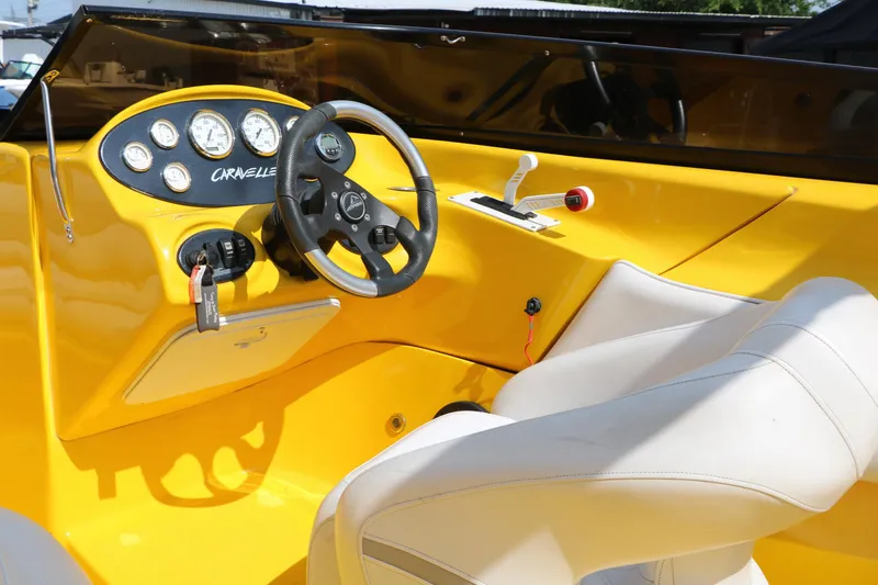 Slide: The Image of Yellow 2012 Caravelle Interceptor 232 Bow Rider dashboard with steering wheel and gauges. - 29