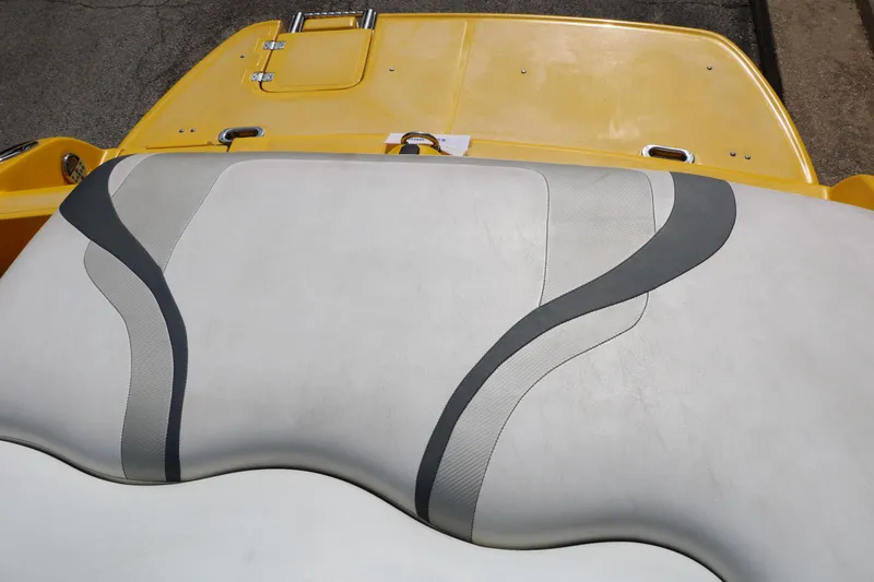 Slide: The Image of Caravelle Interceptor 232 Bow Rider 2012 boat seat with yellow deck, gray accents. - 31