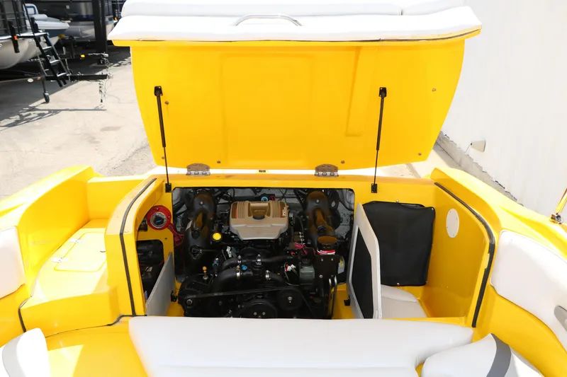 Slide: The Image of 2012 Caravelle Interceptor 232 Bow Rider engine compartment, yellow exterior, open hatch. - 32