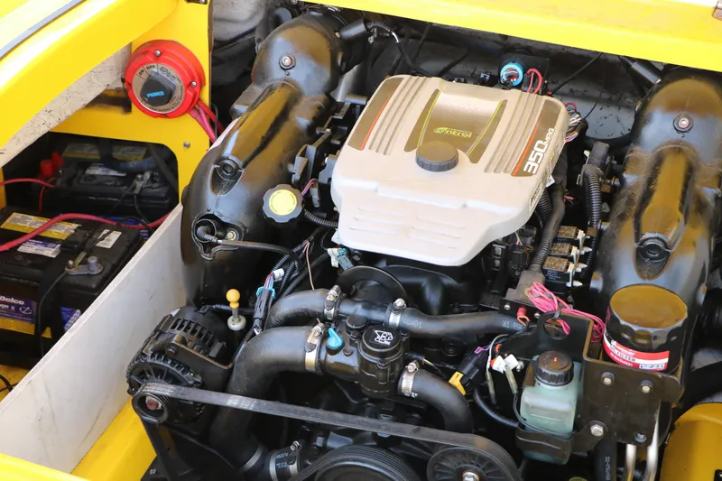 Slide: The Image of Engine of a 2012 Caravelle Interceptor 232 Bow Rider boat, showcasing detailed components. - 34