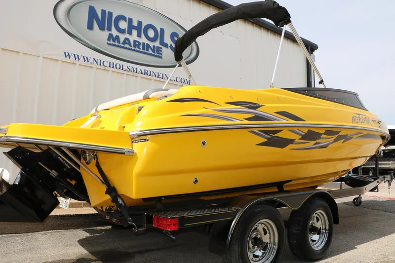 Slide: The Image of Yellow 2012 Caravelle Interceptor 232 Bow Rider boat on trailer at Nichols Marine. - 6