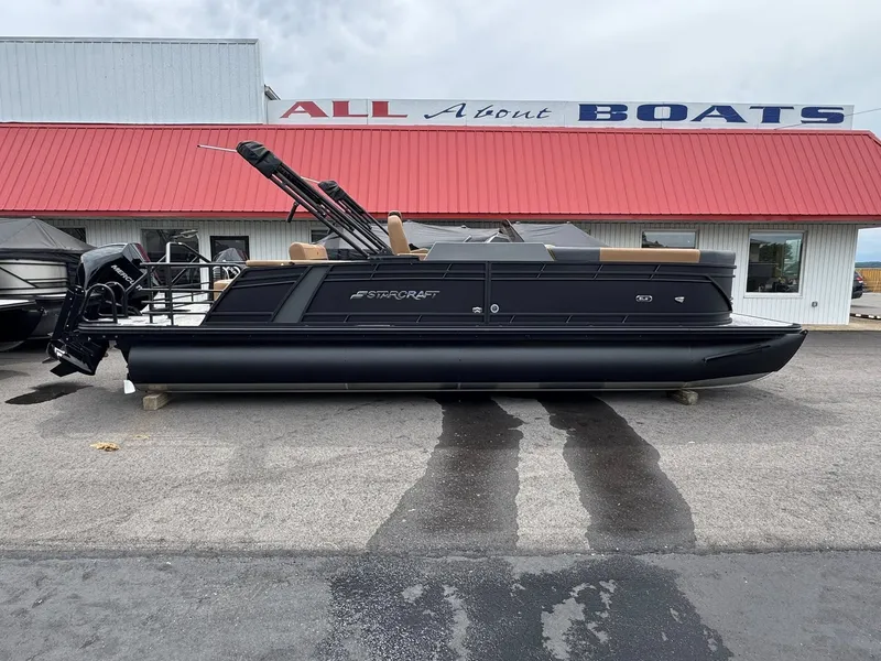 The Image of 2026 Starcraft SLS-5 Q DH pontoon boat in front of boat dealership. - 1