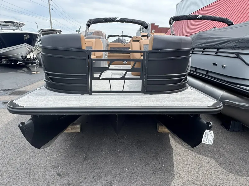 Slide: The Image of 2026 Starcraft SLS-5 Q DH pontoon boat in a parking lot. - 12