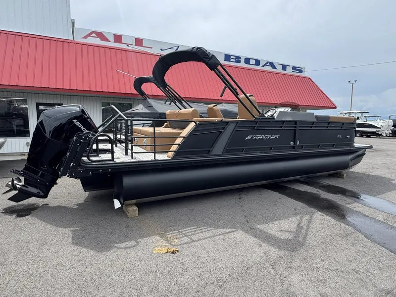 Slide: The Image of 2026 Starcraft SLS-5 Q DH pontoon boat in front of a boat dealership. - 14