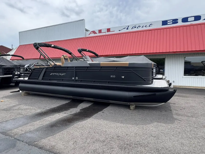 Slide: The Image of 2026 Starcraft SLS-5 Q DH pontoon boat outside a boat dealership. - 17