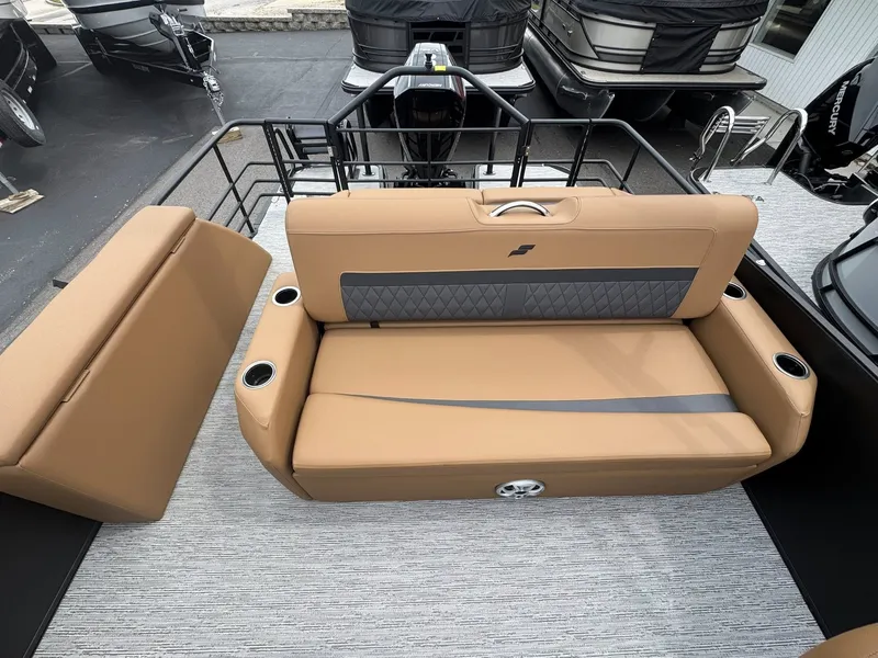 Slide: The Image of Starcraft SLS-5 Q DH 2026 boat seating with cup holders. - 31