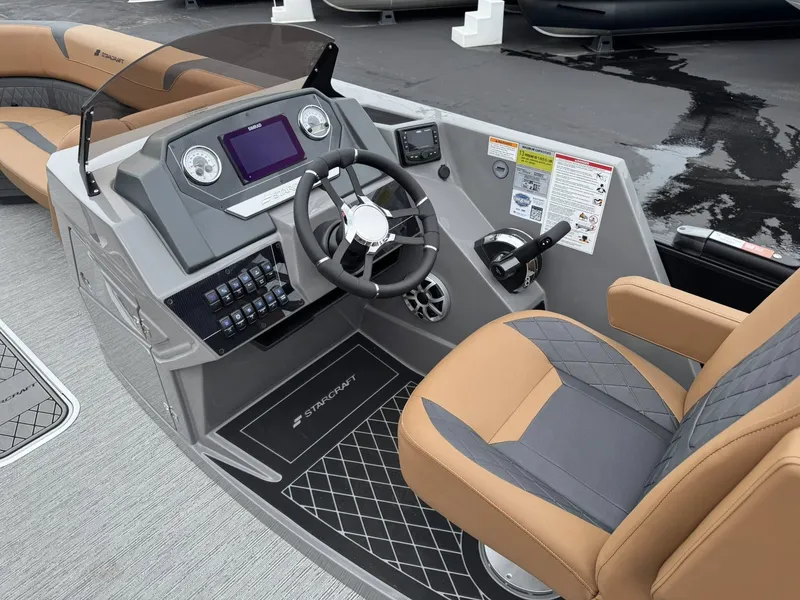 Slide: The Image of Starcraft SLS-5 Q DH 2026 boat console with steering wheel and controls. - 8