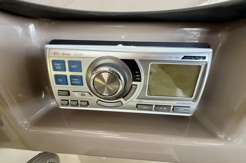 Slide: The Image of Alpine marine CD receiver in a 2000 Carver 396 Motor Yacht dashboard. - 11