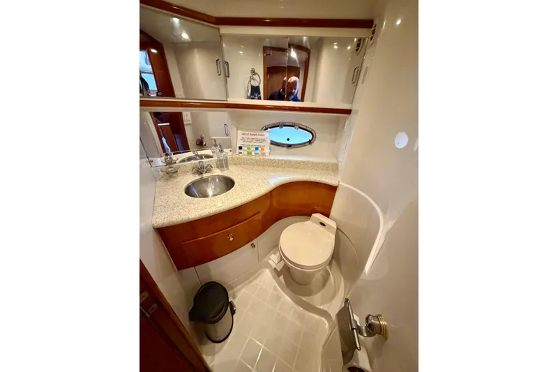 Slide: The Image of Luxurious bathroom in 2000 Carver 396 Motor Yacht with modern fixtures and elegant design. - 22