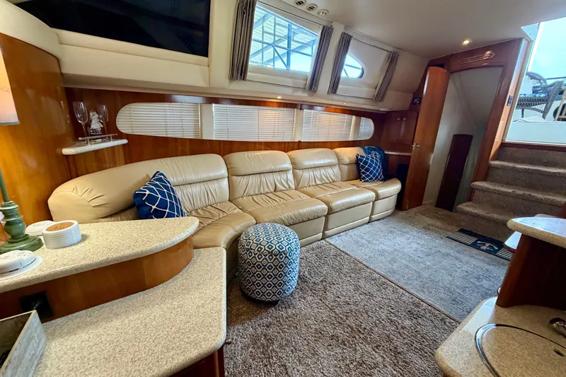 Slide: The Image of Luxurious interior of a 2000 Carver 396 Motor Yacht with plush seating and elegant decor. - 23