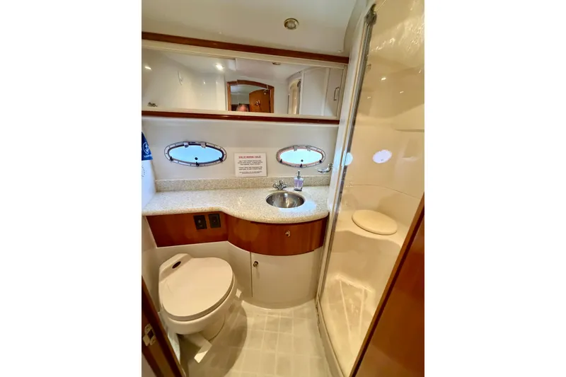 Slide: The Image of Luxurious bathroom in 2000 Carver 396 Motor Yacht with modern fixtures and elegant design. - 27
