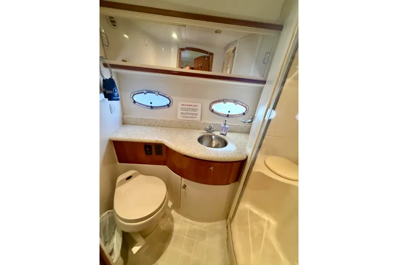 Slide: The Image of Bathroom interior of 2000 Carver 396 Motor Yacht with sink, toilet, and shower. - 29