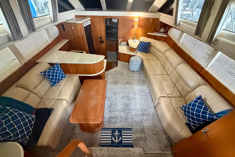 Slide: The Image of Luxurious interior of 2000 Carver 396 Motor Yacht with plush seating and nautical decor. - 30