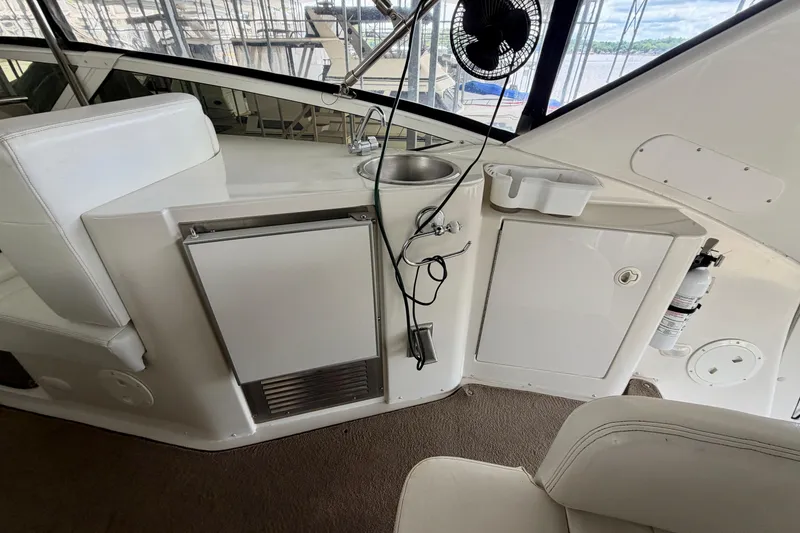 Slide: The Image of Interior view of 2000 Carver 396 Motor Yacht with kitchenette and seating area. - 9