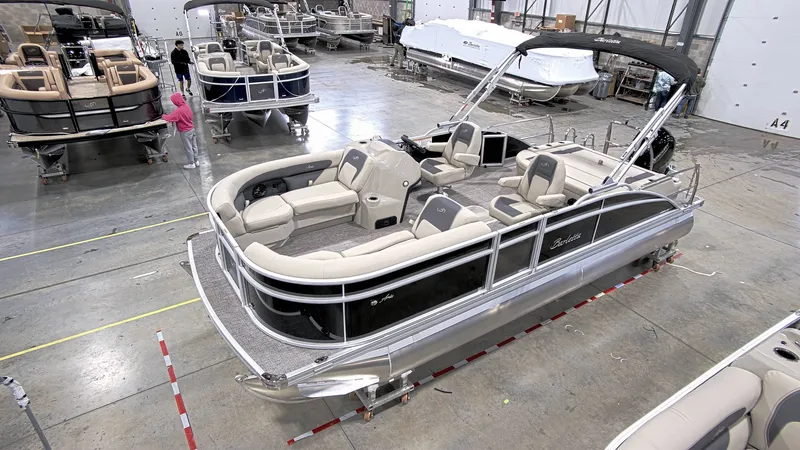 The Image of 2023 Barletta C24UC pontoon boat in a showroom. - 1