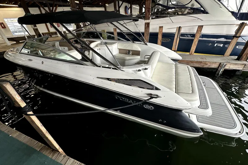 Slide: The Image of 2008 Cobalt 302 boat docked in marina, featuring sleek design and spacious seating. - 1