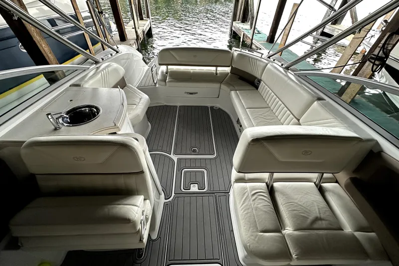 Slide: The Image of 2008 Cobalt 302 boat interior with white seating and sleek design. - 4