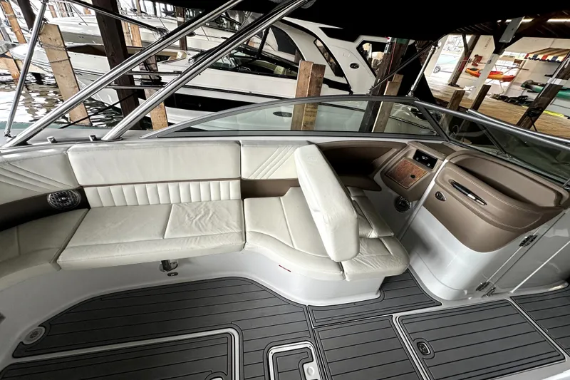 Slide: The Image of 2008 Cobalt 302 boat interior with white leather seating and sleek dashboard design. - 6