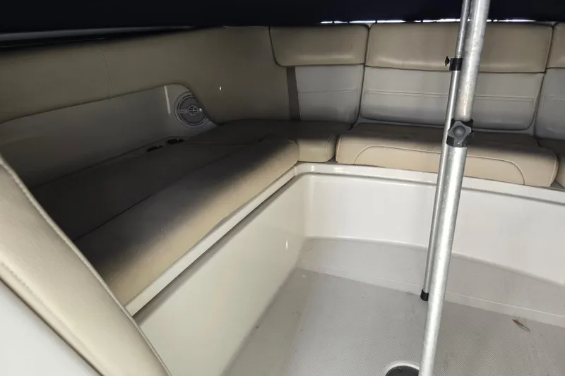 Slide: The Image of Interior seating of 2015 World Cat 295 DC boat with beige upholstery. - 30