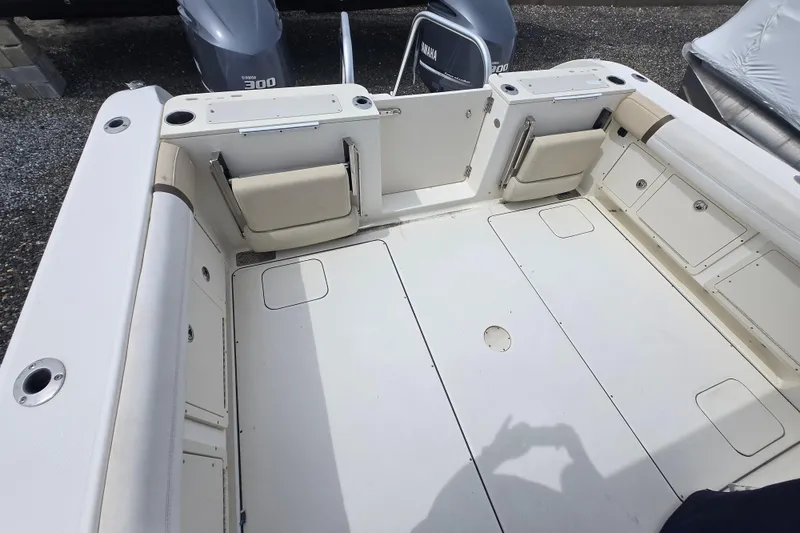 Slide: The Image of 2015 World Cat 295 DC boat interior with Yamaha engines, featuring spacious seating and storage. - 6