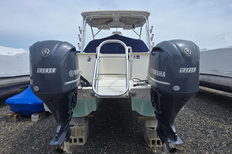 Slide: The Image of 2015 World Cat 295 DC boat with dual Yamaha 300 engines, rear view. - 9