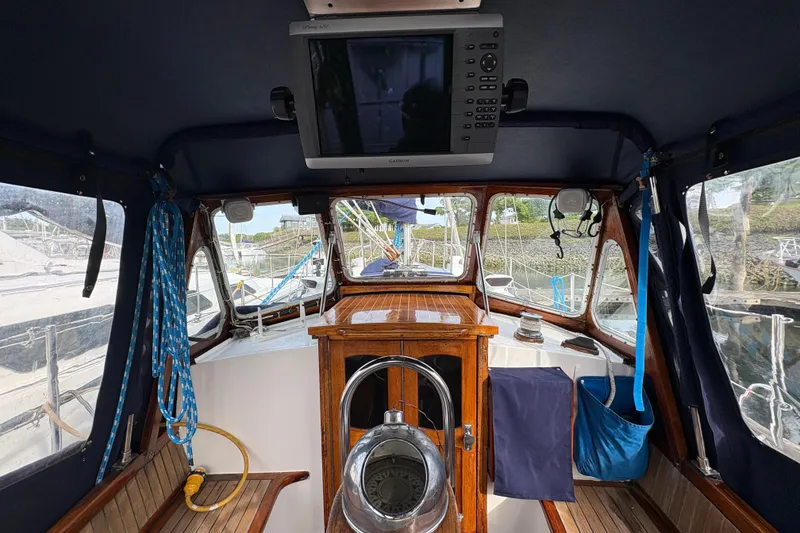 Slide: The Image of Interior view of a 1977 Folkes Full Keel Offshore Cutter sailboat cockpit. - 24