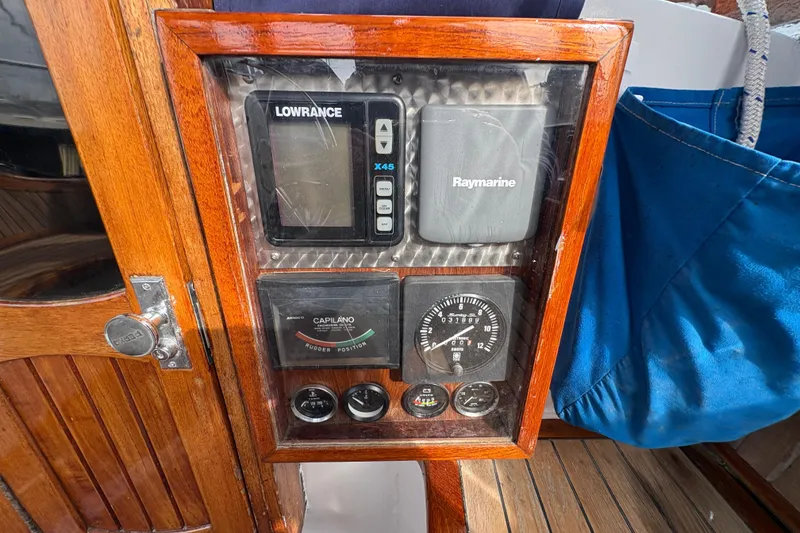 Slide: The Image of Control panel of a 1977 Folkes Full Keel Offshore Cutter with navigation instruments. - 28