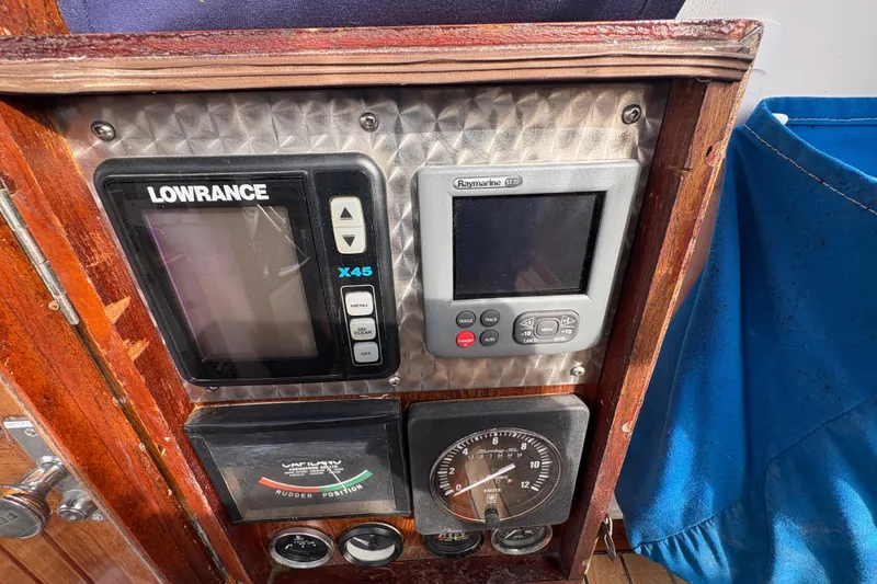 Slide: The Image of Control panel of a 1977 Folkes Full Keel Offshore Cutter with navigation instruments. - 29