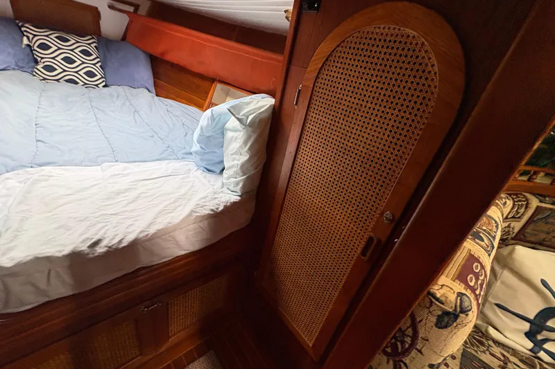 Slide: The Image of Cozy cabin interior of 1977 Folkes Full Keel Offshore Cutter with bed and wooden cabinetry. - 44