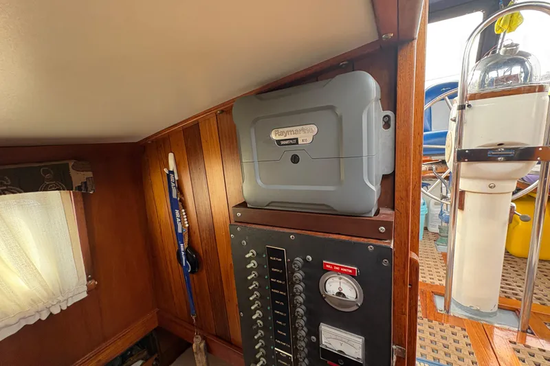 Slide: The Image of Interior of 1977 Folkes Full Keel Offshore Cutter with Raymarine autopilot and control panel. - 59