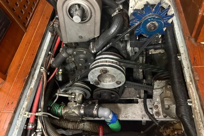 Slide: The Image of Engine compartment of a 1977 Folkes Full Keel Offshore Cutter, showcasing mechanical components. - 66