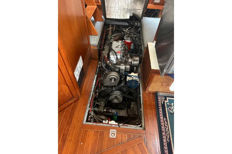 Slide: The Image of Engine compartment of a 1977 Folkes Full Keel Offshore Cutter, showcasing detailed mechanical components. - 67