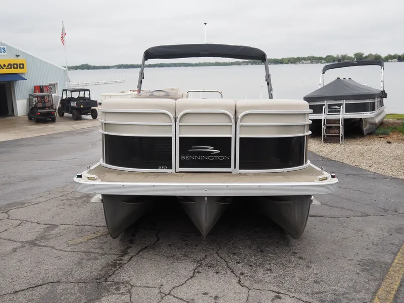 Slide: The Image of 2015 Bennington S21 pontoon boat parked by the lakeside. - 3