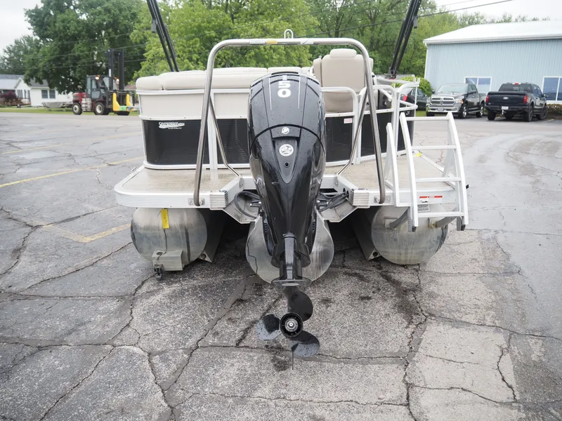 Slide: The Image of Rear view of a 2015 Bennington S21 pontoon boat with outboard motor. - 5