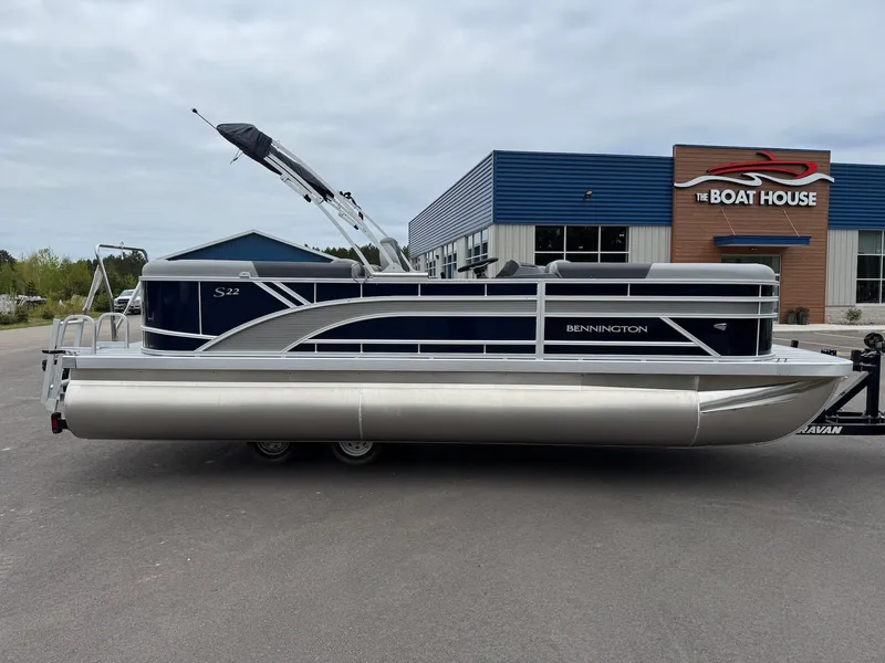 Slide: The Image of 2026 Bennington 22SSR pontoon boat parked outside a building. - 20